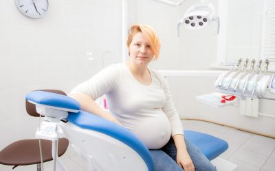 What are the oral health risks and problems linked to pregnancy?